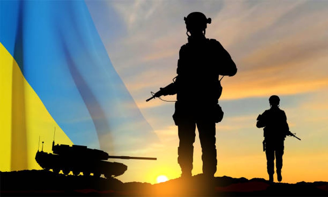 Silhouettes of a soldiers and a main battle tank on a battlefield with Ukraine flag against the sunset. EPS10 vector Silhouettes of a soldiers and a main battle tank on a battlefield with Ukraine flag against the sunset. EPS10 vector