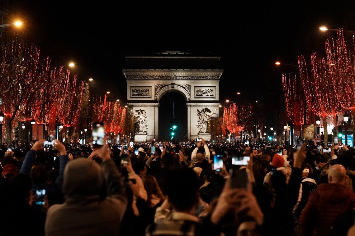 People celebrate the New Year's Eve on the Champs Elysees avenue, in Paris, Friday, Dec. 31, 2021. (AP Photo/Thibault Camus) People celebrate the New Year's Eve on the Champs Elysees avenue, in Paris, Friday, Dec. 31, 2021. (AP Photo/Thibault Camus)