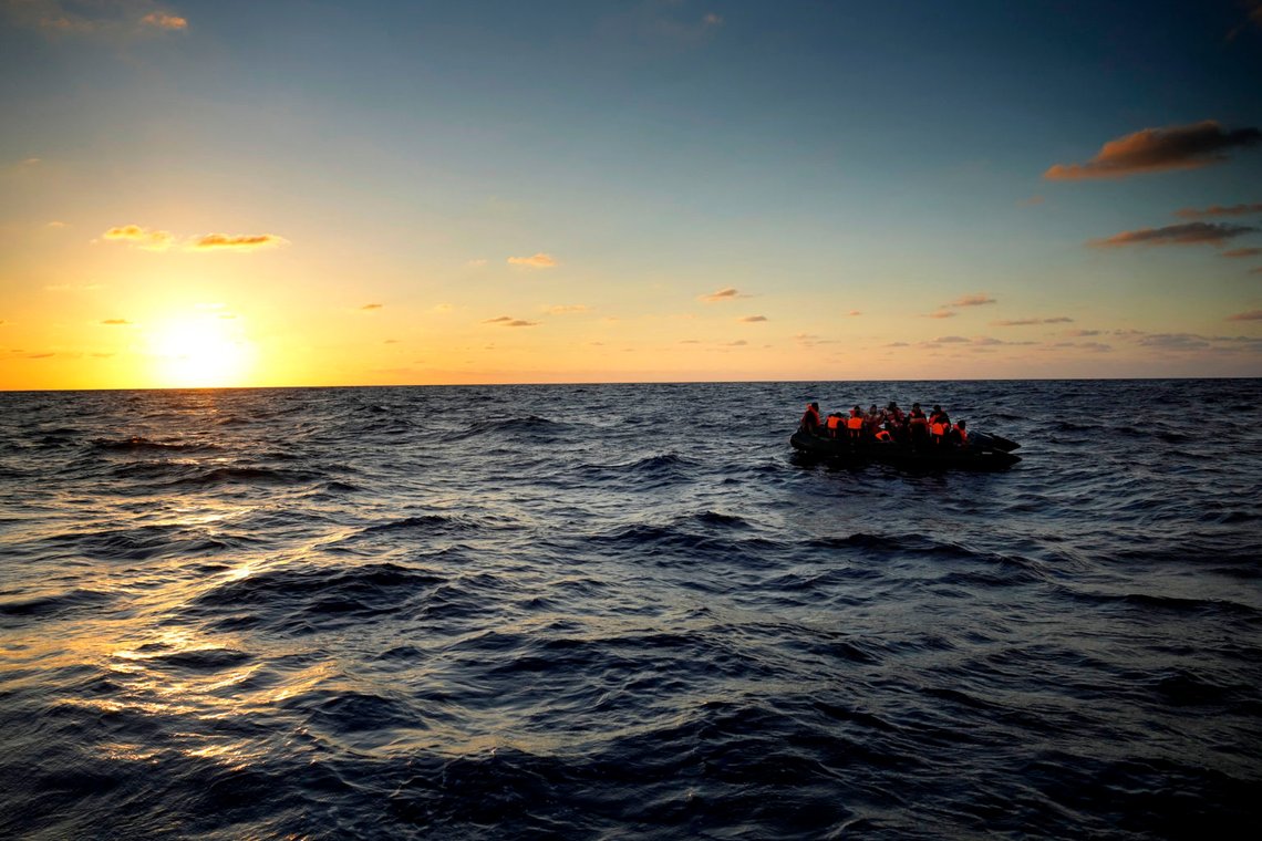 FILE - Migrants wait to be rescued by the Spanish NGO Open Arms lifeguards during a rescue operation at international waters zone of Libya SAR (Search and Rescue) in the Mediterranean sea, on Sept. 15, 2022. A court in eastern Libya sentenced five people to life in prison after they were convicted of human trafficking over the deaths of 11 migrants who were on a rickety boat trying to cross the Mediterranean to Europe, the office of Libya’s chief prosecutor said Monday July 10, 2023. (AP Photo/Petros Karadjias, File) FILE - Migrants wait to be rescued by the Spanish NGO Open Arms lifeguards during a rescue operation at international waters zone of Libya SAR (Search and Rescue) in the Mediterranean sea, on Sept. 15, 2022. A court in eastern Libya sentenced five people to life in prison after they were convicted of human trafficking over the deaths of 11 migrants who were on a rickety boat trying to cross the Mediterranean to Europe, the office of Libya’s chief prosecutor said Monday July 10, 2023. (AP Photo/Petros Karadjias, File)