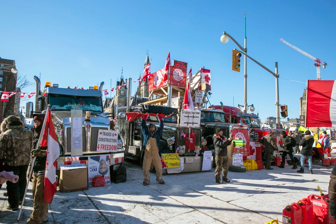 FILE- Drivers parked their trucks blocking lanes of traffic to protest against pandemic restrictions in Ottawa, Ontario, on Monday, Feb. 14, 2022. A public commission announced Friday, Feb. 17, 2023, that Canadian Prime Minister Justin Trudeau’s government met the “very high threshold” for invoking the Emergencies Act to quell the protests by truckers and others angry over Canada’s COVID-19 restrictions last winter. (AP Photo/Ted Shaffrey, File) FILE- Drivers parked their trucks blocking lanes of traffic to protest against pandemic restrictions in Ottawa, Ontario, on Monday, Feb. 14, 2022. A public commission announced Friday, Feb. 17, 2023, that Canadian Prime Minister Justin Trudeau’s government met the “very high threshold” for invoking the Emergencies Act to quell the protests by truckers and others angry over Canada’s COVID-19 restrictions last winter. (AP Photo/Ted Shaffrey, File)