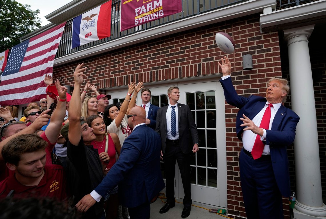 FILE - Former President Donald Trump throws a football to the crowd during a visit to the Alpha Gamma Rho fraternity, at Iowa State University before an NCAA college football game between Iowa State and Iowa, Sept. 9, 2023, in Ames, Iowa. In 2024, Iowa will again hold the first Republican contest. Trump lost Iowa to Texas Sen. Ted Cruz in 2016, but then dominated in New Hampshire, South Carolina and Nevada. (AP Photo/Charlie Neibergall, File) FILE - Former President Donald Trump throws a football to the crowd during a visit to the Alpha Gamma Rho fraternity, at Iowa State University before an NCAA college football game between Iowa State and Iowa, Sept. 9, 2023, in Ames, Iowa. In 2024, Iowa will again hold the first Republican contest. Trump lost Iowa to Texas Sen. Ted Cruz in 2016, but then dominated in New Hampshire, South Carolina and Nevada. (AP Photo/Charlie Neibergall, File)