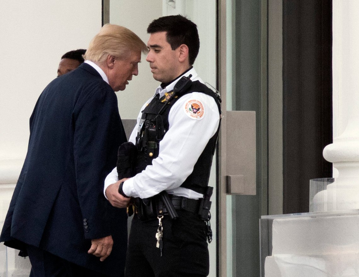 President Donald Trump walks past a Uniformed Secret Service Police on the North Portico upon arrival at the White House in Washington, Saturday, April 22, 2017, from a visit to the Walter Reed National Military Medical Center. (AP Photo/Manuel Balce Ceneta) President Donald Trump walks past a Uniformed Secret Service Police on the North Portico upon arrival at the White House in Washington, Saturday, April 22, 2017, from a visit to the Walter Reed National Military Medical Center. (AP Photo/Manuel Balce Ceneta)