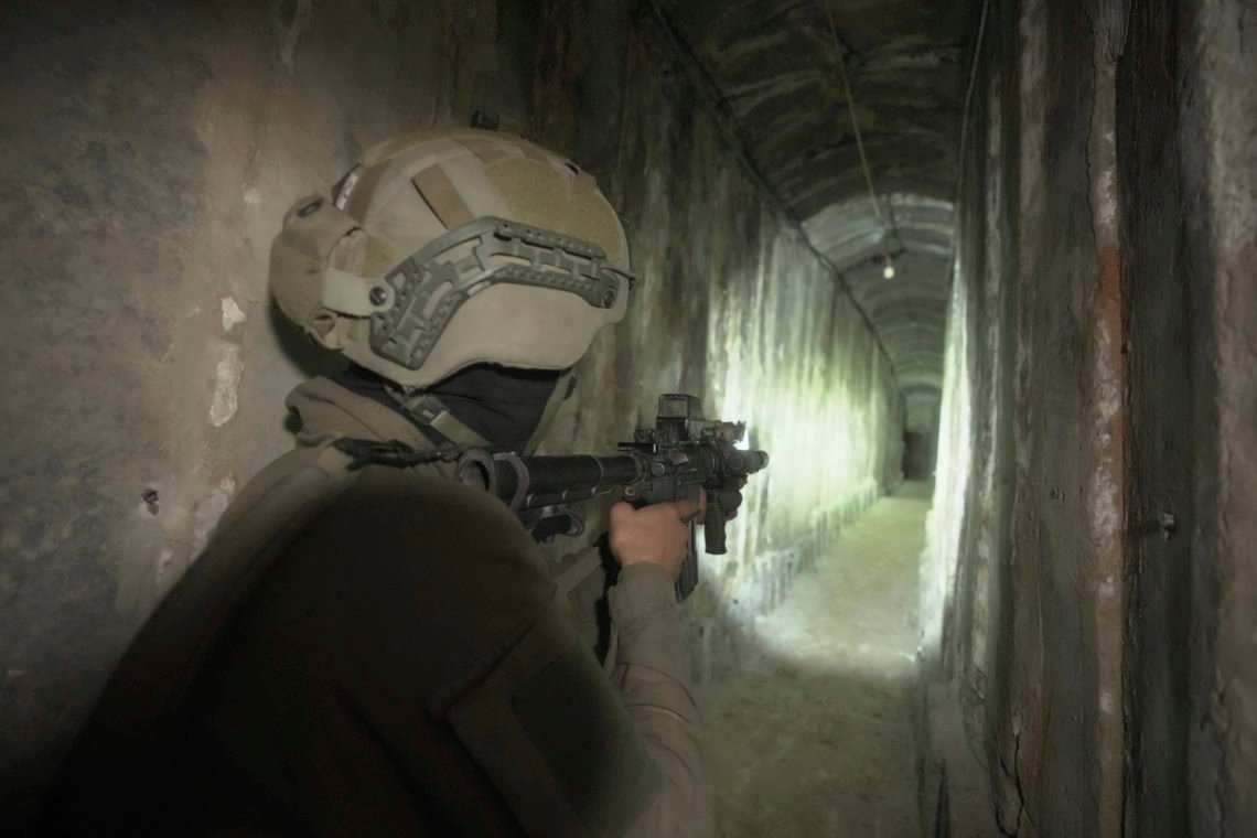 ILE - Israeli soldiers show the media an underground tunnel found underneath Shifa Hospital in Gaza City, Nov. 22, 2023. The U.S. is “confident” that Palestinian militant groups used Gaza's largest hospital to hold “at least a few” hostages seized during their bloody Oct. 7 attack and to house command infrastructure, an American intelligence assessment declassified Tuesday, Jan. 2, 2024, and shared by a U.S. official found. (AP Photo/Victor R. Caivano, File) ILE - Israeli soldiers show the media an underground tunnel found underneath Shifa Hospital in Gaza City, Nov. 22, 2023. The U.S. is “confident” that Palestinian militant groups used Gaza's largest hospital to hold “at least a few” hostages seized during their bloody Oct. 7 attack and to house command infrastructure, an American intelligence assessment declassified Tuesday, Jan. 2, 2024, and shared by a U.S. official found. (AP Photo/Victor R. Caivano, File)