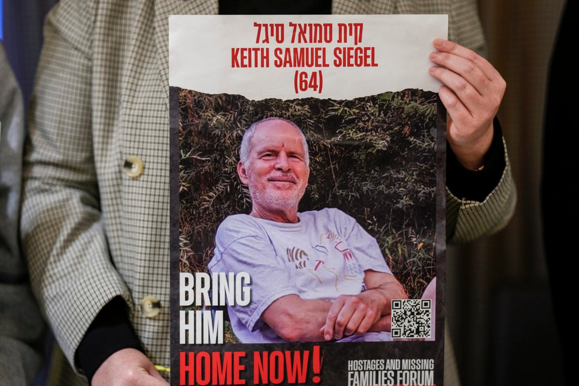 Tal Wax holds a poster with a photograph of her uncle Keith Samuel Siegel, an Israeli-American hostage held in Gaza since the October 7 attacks by Hamas during a press conference in Madrid, Spain, Thursday, Jan. 25, 2024. Israel says Hamas is still holding more than 100 people it captured in an Oct. 7 raid that triggered the current war with Israel. (AP Photo/Manu Fernandez) Tal Wax holds a poster with a photograph of her uncle Keith Samuel Siegel, an Israeli-American hostage held in Gaza since the October 7 attacks by Hamas during a press conference in Madrid, Spain, Thursday, Jan. 25, 2024. Israel says Hamas is still holding more than 100 people it captured in an Oct. 7 raid that triggered the current war with Israel. (AP Photo/Manu Fernandez)