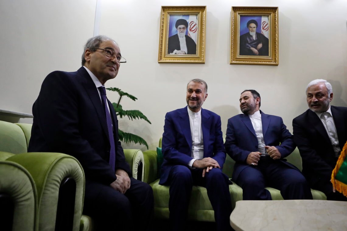 Syrian Foreign Minister Faisal Mekdad, left, meets with Iranian Foreign Minister Hossein Amirabdollahian, second left, and Iranian Ambassador to Syria Hossein Akbari, during the opening of the new Iranian consulate building in Damascus, Syria, Monday, April 8, 2024. Iran's foreign minister Monday accused the United States of giving Israel the "green light" to strike the consulate building in Syria that killed seven Iranian military officials including two generals. (AP Photo/Omar Sanadiki) Syrian Foreign Minister Faisal Mekdad, left, meets with Iranian Foreign Minister Hossein Amirabdollahian, second left, and Iranian Ambassador to Syria Hossein Akbari, during the opening of the new Iranian consulate building in Damascus, Syria, Monday, April 8, 2024. Iran's foreign minister Monday accused the United States of giving Israel the "green light" to strike the consulate building in Syria that killed seven Iranian military officials including two generals. (AP Photo/Omar Sanadiki)
