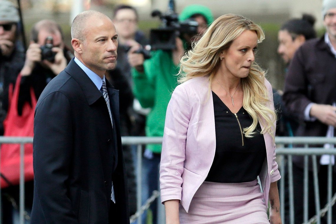 CORRECTS YEAR OF SENTENCING TO 2022, NOT 2020 - FILE - Stormy Daniels and her attorney Michael Avenatti leave federal court in New York, on April 16, 2018. Avenatti was sentenced Thursday, June, 2, 2022, to four years in prison for cheating client Stormy Daniels, the porn actor who catapulted him to fame, of hundreds of thousands of dollars in book proceeds. (AP Photo/Seth Wenig, File) CORRECTS YEAR OF SENTENCING TO 2022, NOT 2020 - FILE - Stormy Daniels and her attorney Michael Avenatti leave federal court in New York, on April 16, 2018. Avenatti was sentenced Thursday, June, 2, 2022, to four years in prison for cheating client Stormy Daniels, the porn actor who catapulted him to fame, of hundreds of thousands of dollars in book proceeds. (AP Photo/Seth Wenig, File)