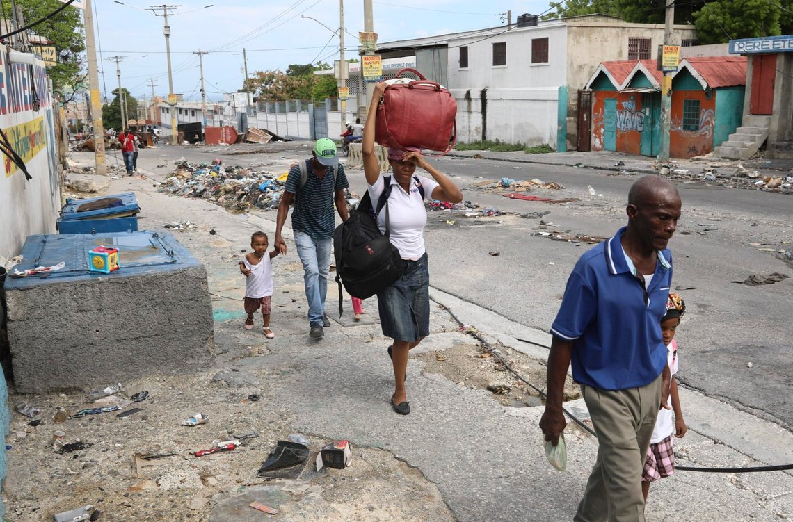 Residents flee their homes in the Delmas 22 neighborhood to escape gang violence in Port-au-Prince, Haiti, Thursday, May 2, 2024. (AP Photo/Odelyn Joseph) Residents flee their homes in the Delmas 22 neighborhood to escape gang violence in Port-au-Prince, Haiti, Thursday, May 2, 2024. (AP Photo/Odelyn Joseph)