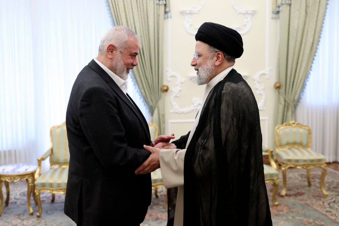 FILE - In this photo released by the Iranian Presidency Office, Iranian President Ebrahim Raisi, right, shakes hands with Hamas chief Ismail Haniyeh at his office in Tehran, Iran, March 27, 2024. Raisi, a hard-line protégé of the country's supreme leader who helped oversee the mass executions of thousands in 1988 and later led the country as it enriched uranium near weapons-grade levels and launched a major drone-and-missile attack on Israel, has died in a helicopter crash, according to state media on Monday, May 20, 2024. (Iranian Presidency Office via AP, File) FILE - In this photo released by the Iranian Presidency Office, Iranian President Ebrahim Raisi, right, shakes hands with Hamas chief Ismail Haniyeh at his office in Tehran, Iran, March 27, 2024. Raisi, a hard-line protégé of the country's supreme leader who helped oversee the mass executions of thousands in 1988 and later led the country as it enriched uranium near weapons-grade levels and launched a major drone-and-missile attack on Israel, has died in a helicopter crash, according to state media on Monday, May 20, 2024. (Iranian Presidency Office via AP, File)