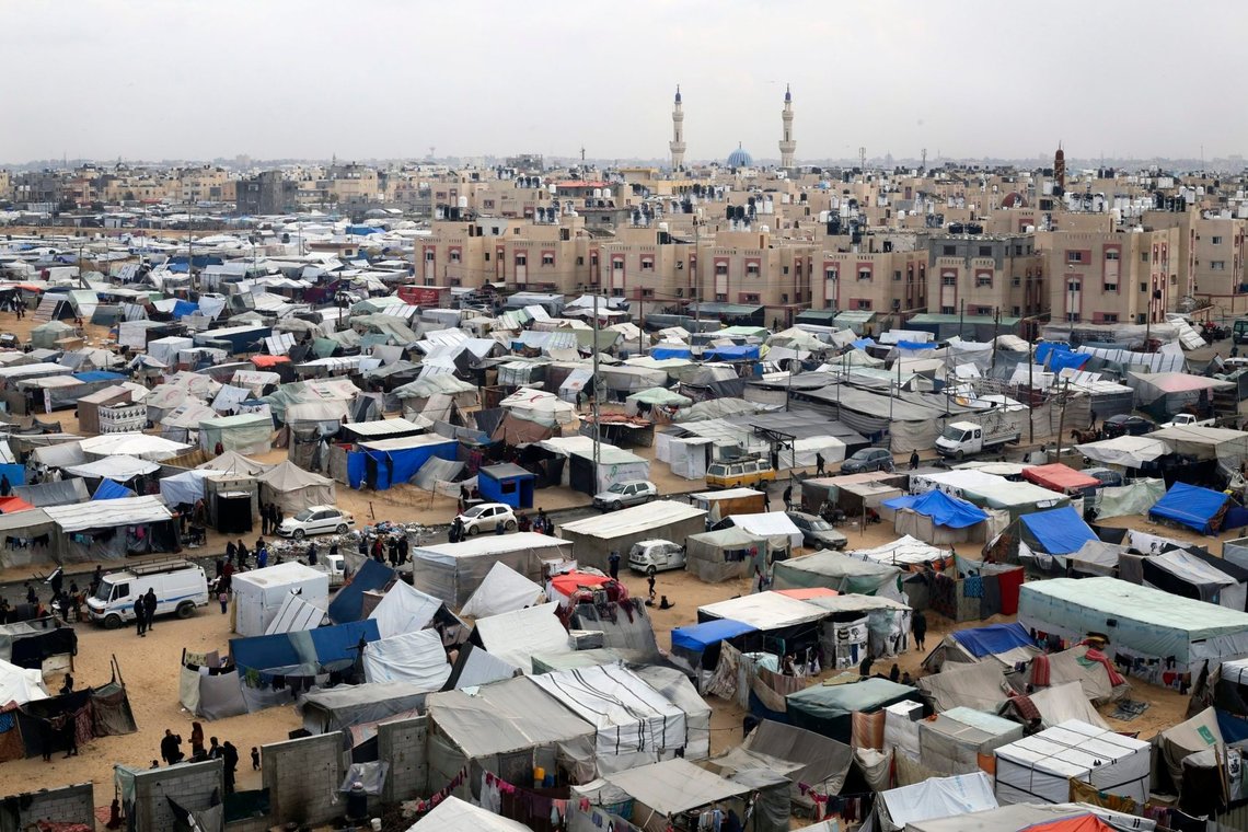 FILE - A tent camp housing Palestinians displaced by the Israeli offensive is seen in Rafah, Gaza Strip, on Feb. 27, 2024. The tent camps stretch for more than 16 kilometers (10 miles) along Gaza’s coast, filling the beach and sprawling into empty lots, fields and town streets. (AP Photo/Hatem Ali, file) FILE - A tent camp housing Palestinians displaced by the Israeli offensive is seen in Rafah, Gaza Strip, on Feb. 27, 2024. The tent camps stretch for more than 16 kilometers (10 miles) along Gaza’s coast, filling the beach and sprawling into empty lots, fields and town streets. (AP Photo/Hatem Ali, file)