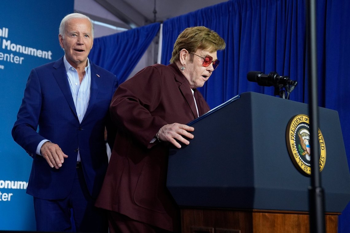 Elton John, right, prepares to speak as President Joe Biden looks on at the grand opening ceremony for the Stonewall National Monument Visitor Center, Friday, June 28, 2024, in New York. (AP Photo/Evan Vucci) Elton John, right, prepares to speak as President Joe Biden looks on at the grand opening ceremony for the Stonewall National Monument Visitor Center, Friday, June 28, 2024, in New York. (AP Photo/Evan Vucci)