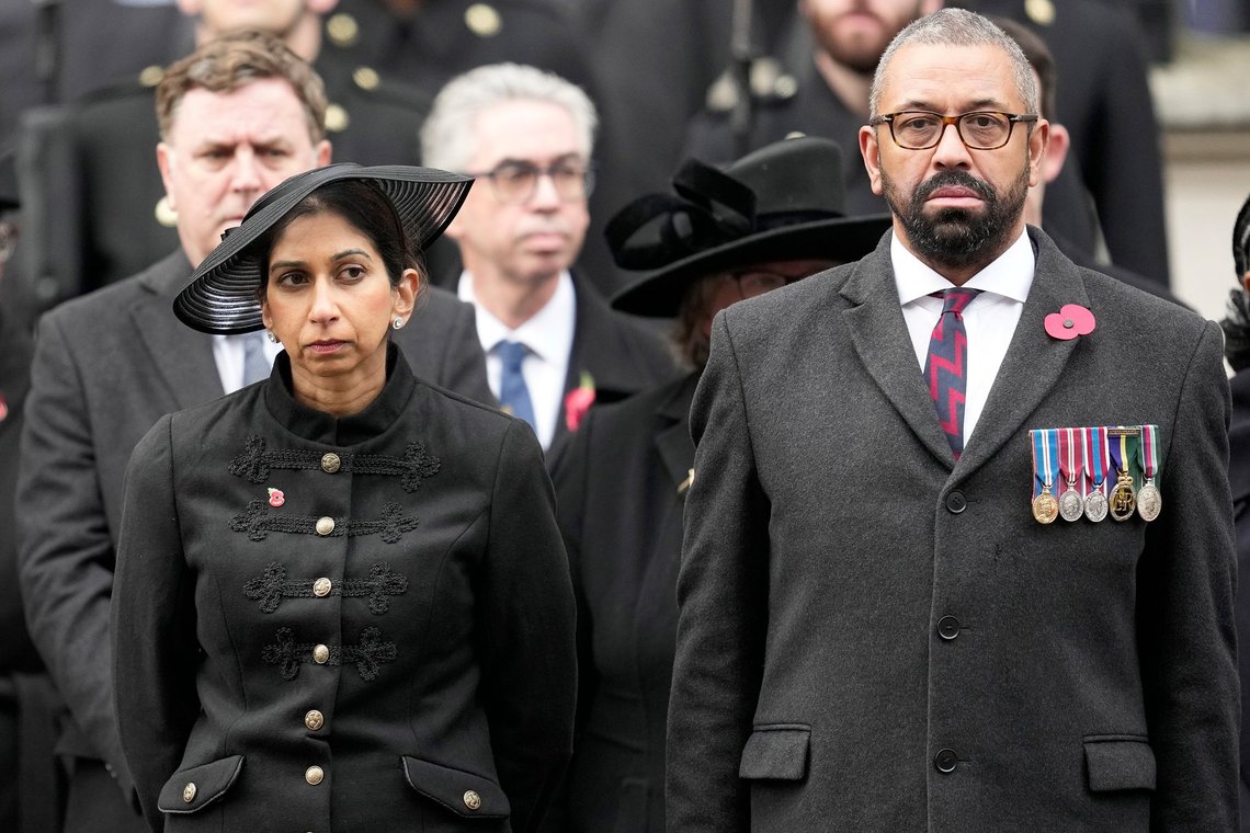 FILE - Britain's Home Secretary Suella Braverman stands with Foreign Secretary James Cleverly as they attend the Remembrance Sunday service at the Cenotaph on Whitehall in London, Sunday, Nov. 12, 2023. The government said on Monday, Nov. 13, 2023, Braverman had left her job as part of a Cabinet shuffle as Prime Minister Rishi Sunak shakes up his top government team. She was replaced by James Cleverly, who had been foreign secretary. (AP Photo/Kin Cheung, Pool, File) FILE - Britain's Home Secretary Suella Braverman stands with Foreign Secretary James Cleverly as they attend the Remembrance Sunday service at the Cenotaph on Whitehall in London, Sunday, Nov. 12, 2023. The government said on Monday, Nov. 13, 2023, Braverman had left her job as part of a Cabinet shuffle as Prime Minister Rishi Sunak shakes up his top government team. She was replaced by James Cleverly, who had been foreign secretary. (AP Photo/Kin Cheung, Pool, File)