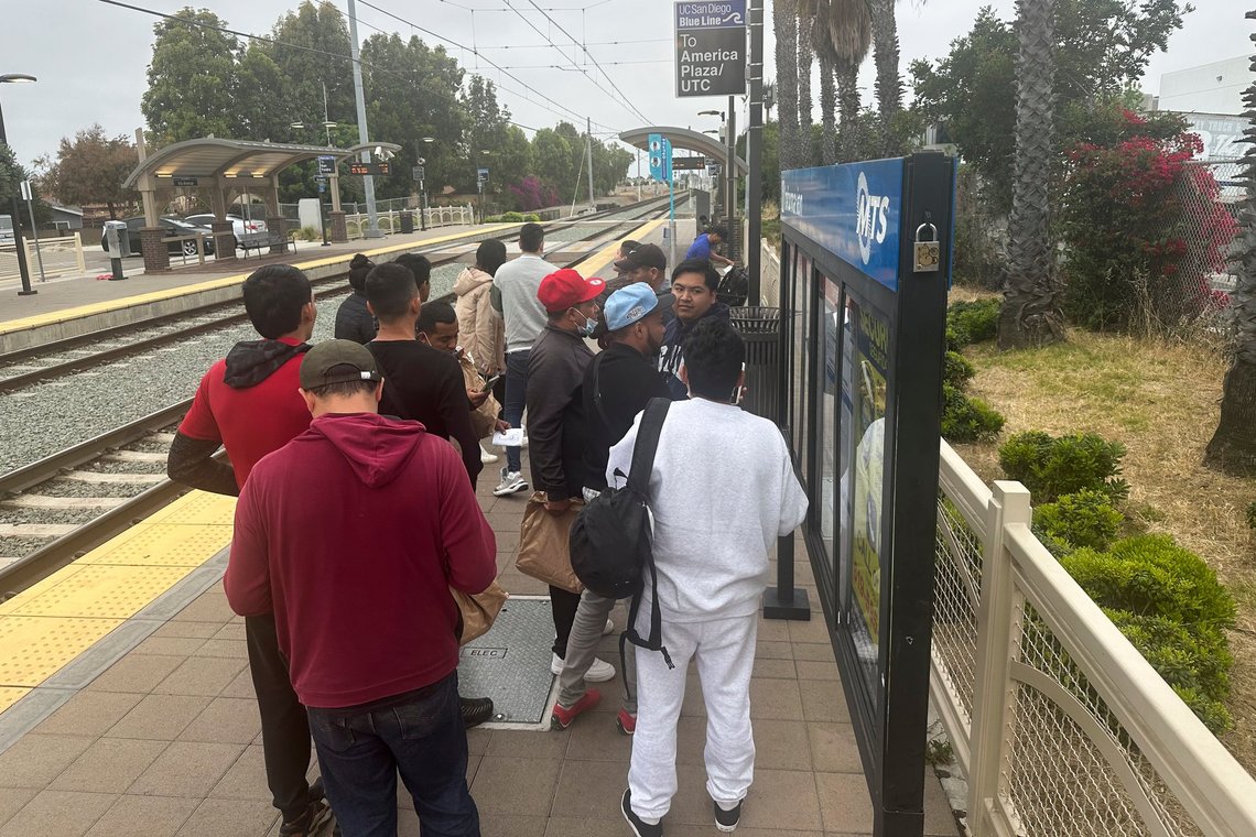 Migrants released with notices to appear in immigration court wait for a train to the San Diego International Airport in San Diego, Calif., Thursday, June 6, 2024. President Joe Biden has suspended asylum processing at the U.S. border under a new policy unveiled this week. But the proclamation has an exception for “operational considerations.” The Homeland Security Department said in a detailed document outlining the ban that “demographics and nationalities encountered at the border significantly impact” its ability to deport people. (AP Photo/Elliot Spagat) Migrants released with notices to appear in immigration court wait for a train to the San Diego International Airport in San Diego, Calif., Thursday, June 6, 2024. President Joe Biden has suspended asylum processing at the U.S. border under a new policy unveiled this week. But the proclamation has an exception for “operational considerations.” The Homeland Security Department said in a detailed document outlining the ban that “demographics and nationalities encountered at the border significantly impact” its ability to deport people. (AP Photo/Elliot Spagat)