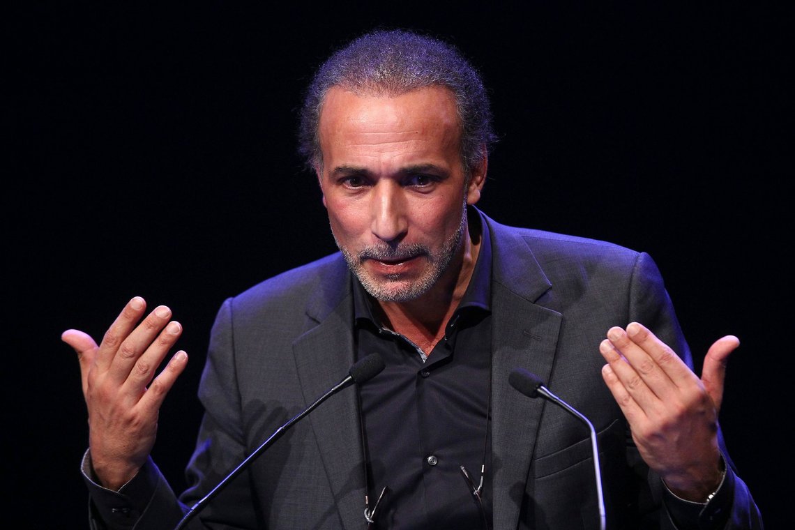 FILE - In this Feb.7, 2016 file photo, Muslim scholar Tariq Ramadan delivers a speech during a French Muslim organizations meeting in Lille, northern France. A third woman has filed a rape complaint against prominent Islamic scholar Tariq Ramadan who has been jailed on preliminary rape charges in France since last month following two other women's allegations. (AP Photo/Michel Spingler, File) FILE - In this Feb.7, 2016 file photo, Muslim scholar Tariq Ramadan delivers a speech during a French Muslim organizations meeting in Lille, northern France. A third woman has filed a rape complaint against prominent Islamic scholar Tariq Ramadan who has been jailed on preliminary rape charges in France since last month following two other women's allegations. (AP Photo/Michel Spingler, File)