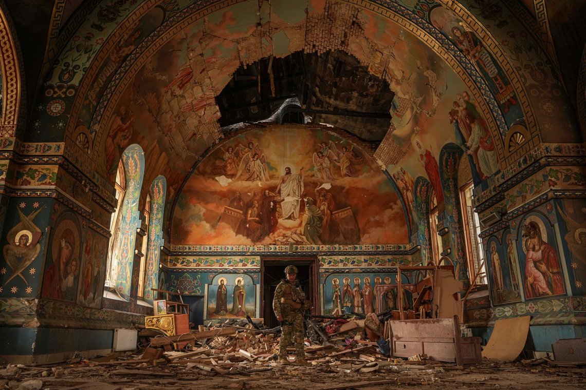 Ukrainian serviceman Gennadiy Yudin stands inside orthodox church heavily damaged by a Russian bombing in Novoekonomichne, Ukraine, Tuesday, Sept. 17, 2024. (AP Photo/Evgeniy Maloletka) Ukrainian serviceman Gennadiy Yudin stands inside orthodox church heavily damaged by a Russian bombing in Novoekonomichne, Ukraine, Tuesday, Sept. 17, 2024. (AP Photo/Evgeniy Maloletka)