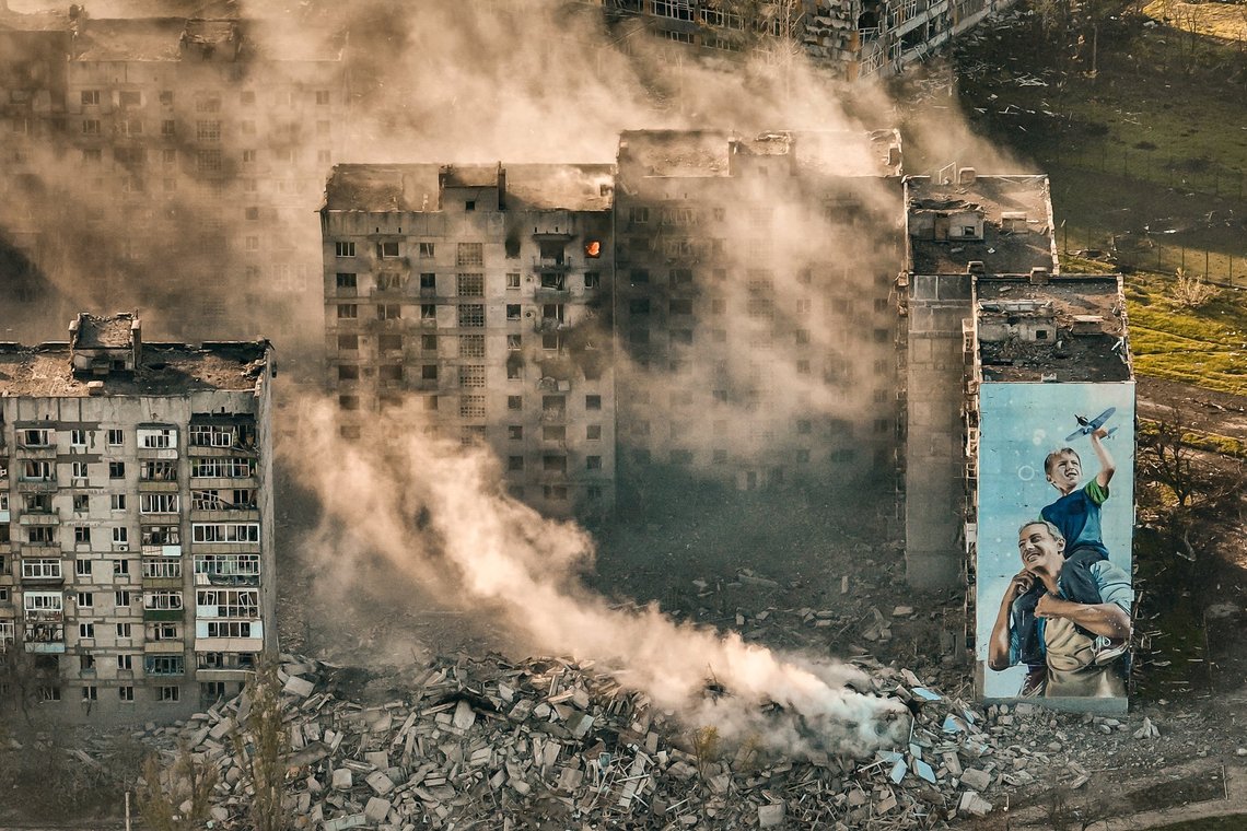 FILE - Smoke rises from a building in Bakhmut, site of the heaviest battles with the Russian troops in the Donetsk region, Ukraine, April 26, 2023. The GOP has been softening its stance on Russia ever since Donald Trump won the 2016 presidential election following Russian hacking of his Democratic opponents. The reasons include Russian President Vladimir Putin holding himself out as an international champion of conservative Christian values, the GOP's growing skepticism of international entanglements and Trump's own personal embrace of the Russian leader. Now the GOP's ambivalence on Russia has stalled additional aid to Ukraine. (AP Photo/Libkos, File) FILE - Smoke rises from a building in Bakhmut, site of the heaviest battles with the Russian troops in the Donetsk region, Ukraine, April 26, 2023. The GOP has been softening its stance on Russia ever since Donald Trump won the 2016 presidential election following Russian hacking of his Democratic opponents. The reasons include Russian President Vladimir Putin holding himself out as an international champion of conservative Christian values, the GOP's growing skepticism of international entanglements and Trump's own personal embrace of the Russian leader. Now the GOP's ambivalence on Russia has stalled additional aid to Ukraine. (AP Photo/Libkos, File)