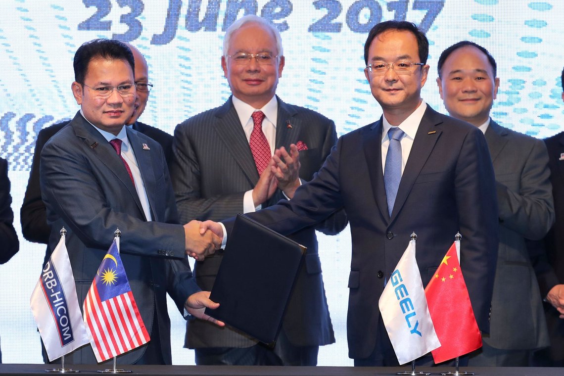 DRB-Hicom Berhad Group Managing Director Syed Faisal Albar, left, poses with Geely Auto Group President An Congfui, second from right, as Malaysian Prime Minister Najib Razak, second from left, and Zhejiang Geely Holding Group Chairman Li Shufu, right, witness a signing ceremony in Kuala Lumpur, Malaysia, Friday, June 23, 2017. Geely, the Chinese owner of SwedenÄôs Volvo Cars, will inject 170.3 million ringgit ($40 million) into MalaysiaÄôs Proton as part of its purchase of a stake in the automaker and is paying 51 million pounds ($65 million) for 51 percent of Proton-owned British sports car maker Lotus, an executive of the Malaysian company said Friday. (AP Photo/Vincent Thian) DRB-Hicom Berhad Group Managing Director Syed Faisal Albar, left, poses with Geely Auto Group President An Congfui, second from right, as Malaysian Prime Minister Najib Razak, second from left, and Zhejiang Geely Holding Group Chairman Li Shufu, right, witness a signing ceremony in Kuala Lumpur, Malaysia, Friday, June 23, 2017. Geely, the Chinese owner of SwedenÄôs Volvo Cars, will inject 170.3 million ringgit ($40 million) into MalaysiaÄôs Proton as part of its purchase of a stake in the automaker and is paying 51 million pounds ($65 million) for 51 percent of Proton-owned British sports car maker Lotus, an executive of the Malaysian company said Friday. (AP Photo/Vincent Thian)