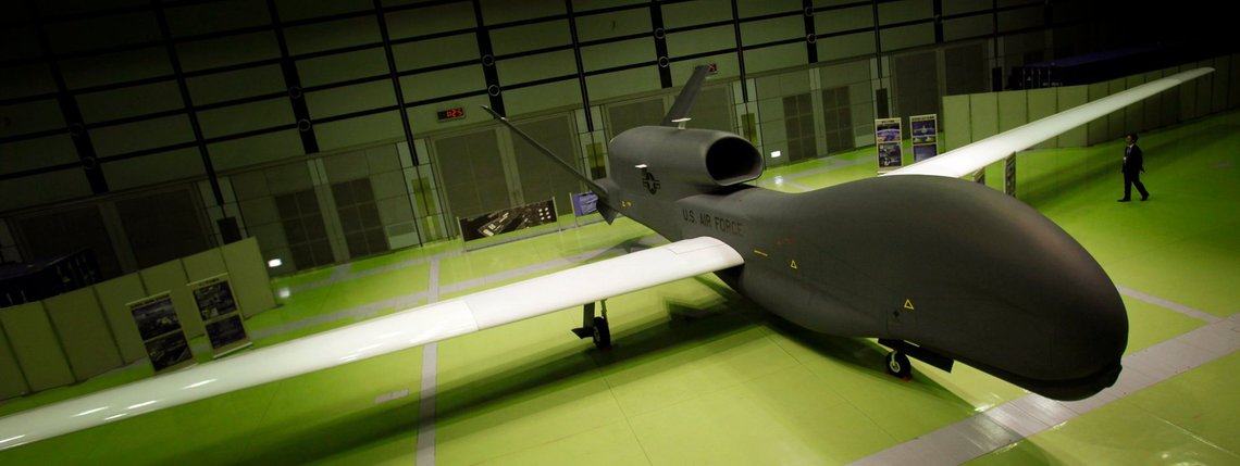 A mockup of Northrop Grumman's Unmanned Aerial Reconnaissance System plane RQ-4 Global Hawk is on display during a press briefing of the plane at a public exhibition hall in Tokyo, Wednesday, March 24, 2010. The Global Hawk can fly at altitudes of more than 60,000 feet for more than 32 hours and send near real-time reconnaissance imagery and signals intelligence data to forces in the air, on the ground and at sea. (AP Photo/Junji Kurokawa) A mockup of Northrop Grumman's Unmanned Aerial Reconnaissance System plane RQ-4 Global Hawk is on display during a press briefing of the plane at a public exhibition hall in Tokyo, Wednesday, March 24, 2010. The Global Hawk can fly at altitudes of more than 60,000 feet for more than 32 hours and send near real-time reconnaissance imagery and signals intelligence data to forces in the air, on the ground and at sea. (AP Photo/Junji Kurokawa)