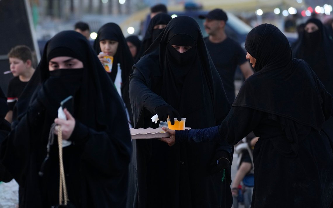 Shiite pilgrims march to Karbala for the Arbaeen ritual, the holiday that marks the end of the forty day mourning period after the anniversary of the martyrdom of Imam Hussein, the Prophet Muhammad's grandson in the 7th century, in Baghdad, Iraq, Thursday, Aug. 22, 2024. (AP Photo/Hadi Mizban) Shiite pilgrims march to Karbala for the Arbaeen ritual, the holiday that marks the end of the forty day mourning period after the anniversary of the martyrdom of Imam Hussein, the Prophet Muhammad's grandson in the 7th century, in Baghdad, Iraq, Thursday, Aug. 22, 2024. (AP Photo/Hadi Mizban)