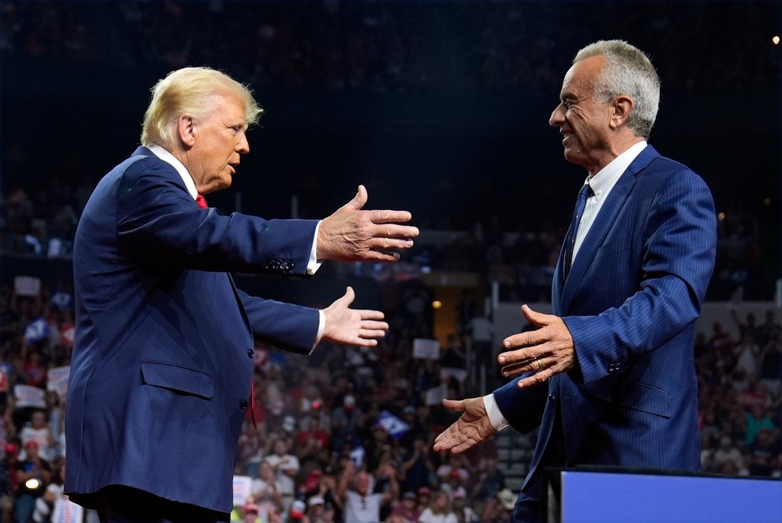 Republican presidential nominee former President Donald Trump greets Independent presidential candidate Robert F. Kennedy Jr. at a campaign rally at the Desert Diamond Arena, Friday, Aug. 23, 2024, in Glendale, Ariz. (AP Photo/Evan Vucci) Republican presidential nominee former President Donald Trump greets Independent presidential candidate Robert F. Kennedy Jr. at a campaign rally at the Desert Diamond Arena, Friday, Aug. 23, 2024, in Glendale, Ariz. (AP Photo/Evan Vucci)