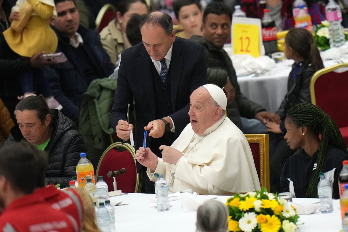 Pope Francis is flanked by his personal nurse Massimiliano Strappetti as he prepares for a lunch with poor people in the Paul VI Hall on the occasion of the World Day of the Poor, at the Vatican, Sunday, Nov. 17, 2024. (AP Photo/Alessandra Tarantino) Pope Francis is flanked by his personal nurse Massimiliano Strappetti as he prepares for a lunch with poor people in the Paul VI Hall on the occasion of the World Day of the Poor, at the Vatican, Sunday, Nov. 17, 2024. (AP Photo/Alessandra Tarantino)
