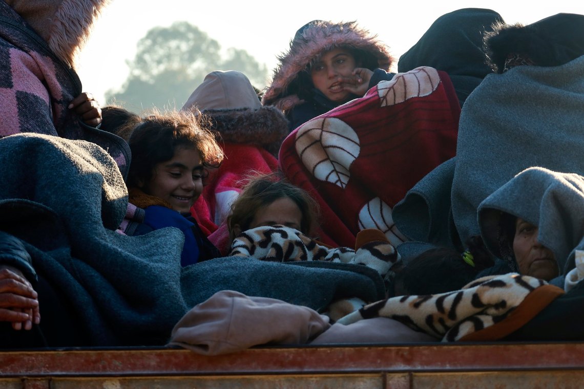 Kurdish people displaced from the Aleppo region arrive to Kurdish controlled areas in Raqqa, Syria, Tuesday Dec. 3, 2024. Thousands of Kurdish families fled Tel Rifaat, north of Aleppo on Tuesday after Syrian opposition groups took control over the city.(AP Photo/Hogir El Abdo) Kurdish people displaced from the Aleppo region arrive to Kurdish controlled areas in Raqqa, Syria, Tuesday Dec. 3, 2024. Thousands of Kurdish families fled Tel Rifaat, north of Aleppo on Tuesday after Syrian opposition groups took control over the city.(AP Photo/Hogir El Abdo)