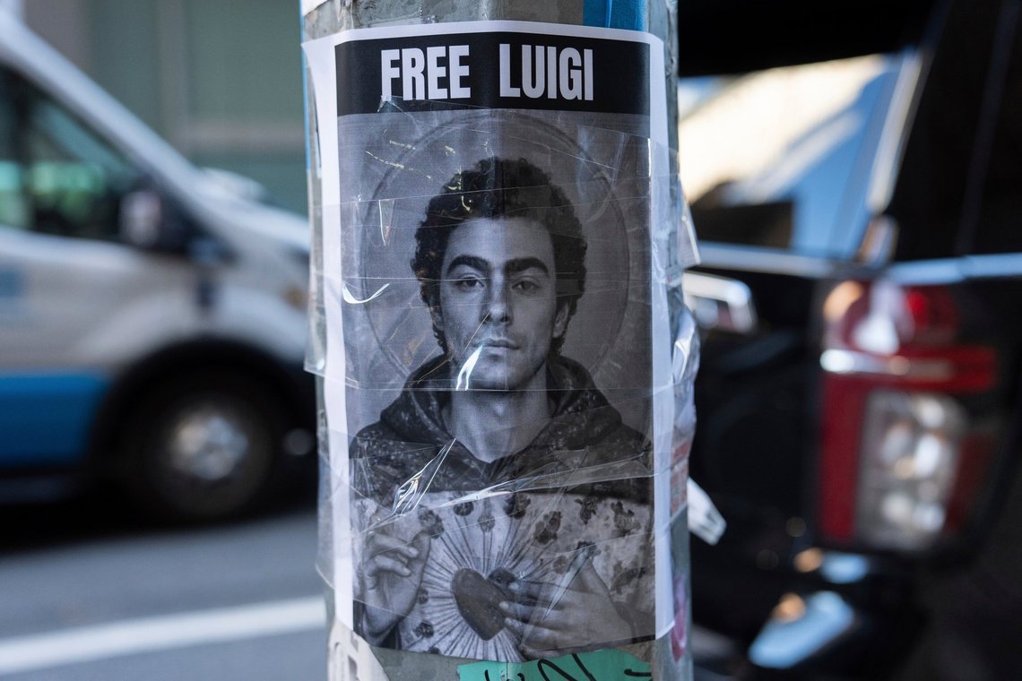 A poster depicting Luigi Mangione hangs outside the New York Hilton Midtown hotel, Thursday, Dec. 12, 2024, in New York. (AP Photo/Julia Demaree Nikhinson) A poster depicting Luigi Mangione hangs outside the New York Hilton Midtown hotel, Thursday, Dec. 12, 2024, in New York. (AP Photo/Julia Demaree Nikhinson)