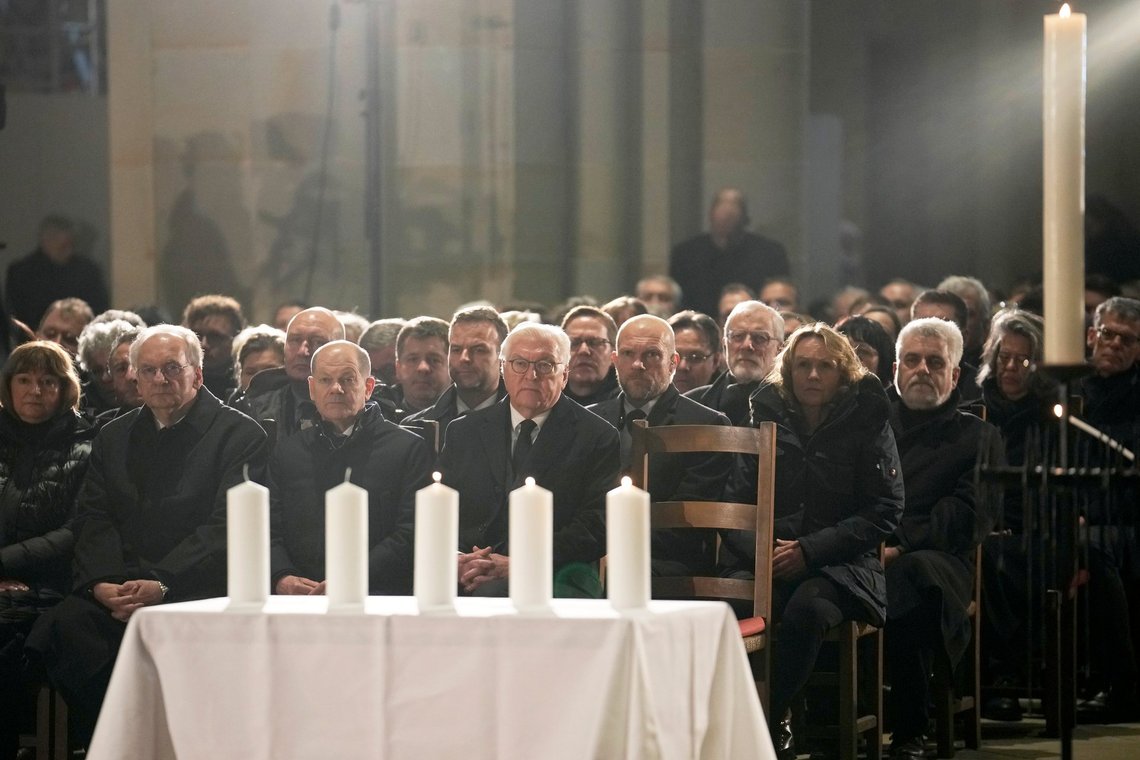 German President Frank-Walter Steinmeier, center, and Chancellor Olaf Scholza, center left, attend a memorial service for victims of Friday's Christmas Market attack, where a car drove into a crowd, in Magdeburg, Germany, Saturday, Dec. 21, 2024. (AP Photo/Ebrahim Noroozi) German President Frank-Walter Steinmeier, center, and Chancellor Olaf Scholza, center left, attend a memorial service for victims of Friday's Christmas Market attack, where a car drove into a crowd, in Magdeburg, Germany, Saturday, Dec. 21, 2024. (AP Photo/Ebrahim Noroozi)