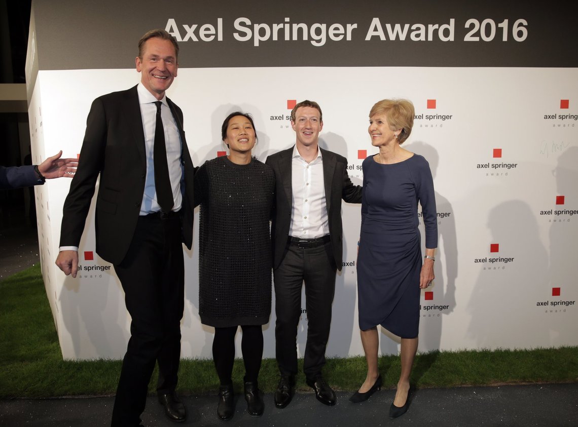 Mathias Doepfner, chairman of the Axel Springer SE, Priscilla and Mark Zuckerberg and publisher Friede Springer, from left, pose for a photograph as they arrive for the awarding ceremony of the newly established Axel Springer Award of the media group Axel Springer in Berlin Thursday, Feb. 25, 2016. (Kay Nietfeld/dpa via AP) Mathias Doepfner, chairman of the Axel Springer SE, Priscilla and Mark Zuckerberg and publisher Friede Springer, from left, pose for a photograph as they arrive for the awarding ceremony of the newly established Axel Springer Award of the media group Axel Springer in Berlin Thursday, Feb. 25, 2016. (Kay Nietfeld/dpa via AP)
