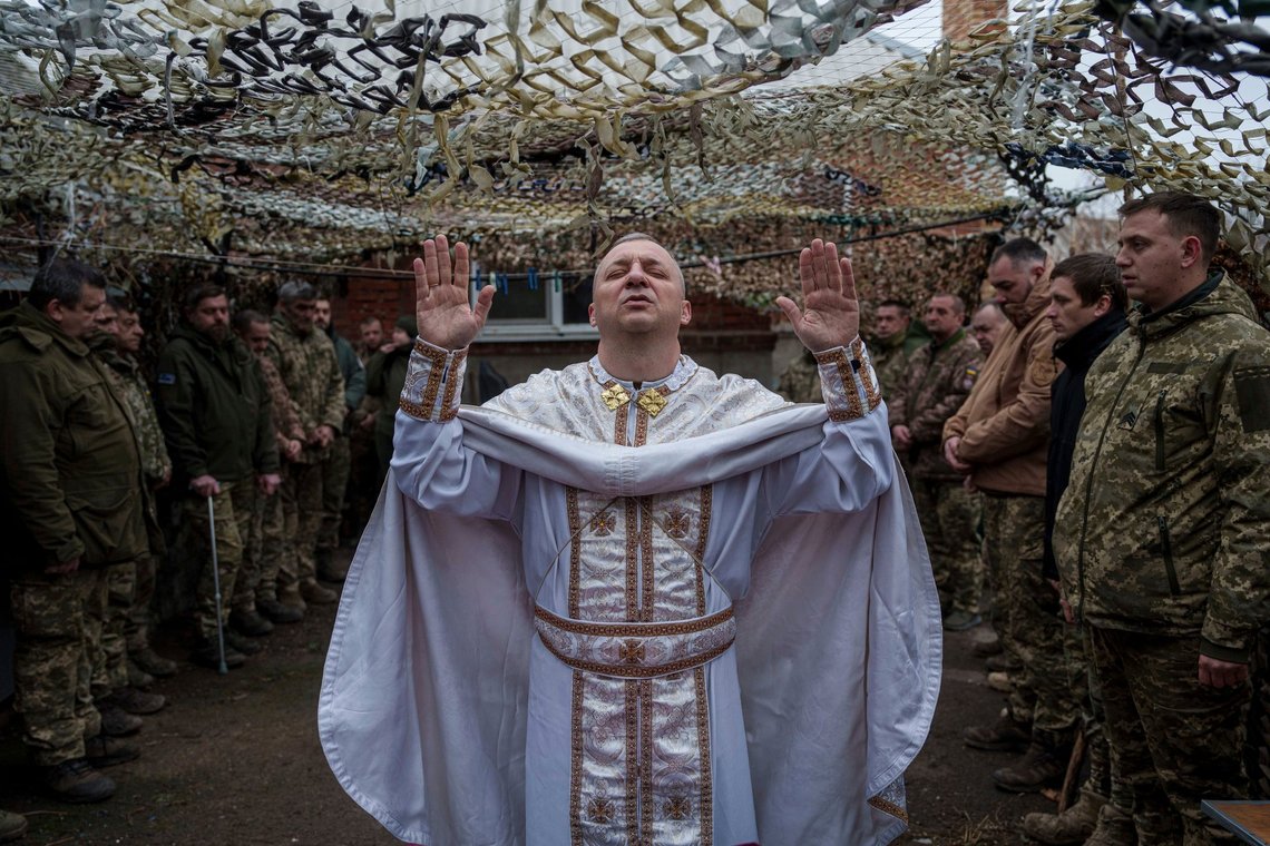 Military chaplain Yurii of the 24th Mechanized Brigade holds a church service for an infantry unit during Christmas near the frontline town of Chasiv Yar, Donetsk region, Ukraine, Wednesday Dec. 25, 2024. (AP Photo/Evgeniy Maloletka) Military chaplain Yurii of the 24th Mechanized Brigade holds a church service for an infantry unit during Christmas near the frontline town of Chasiv Yar, Donetsk region, Ukraine, Wednesday Dec. 25, 2024. (AP Photo/Evgeniy Maloletka)