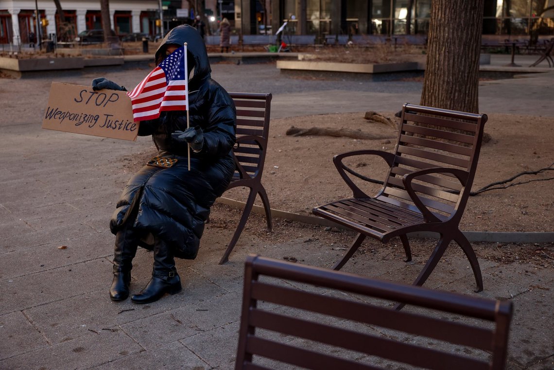 A supporter for President-elect Donald Trump sits outside Manhattan criminal court during the sentencing hearing in Trump's hush money case, Friday, Jan. 10, 2025, in New York. (AP Photo/Yuki Iwamura) A supporter for President-elect Donald Trump sits outside Manhattan criminal court during the sentencing hearing in Trump's hush money case, Friday, Jan. 10, 2025, in New York. (AP Photo/Yuki Iwamura)