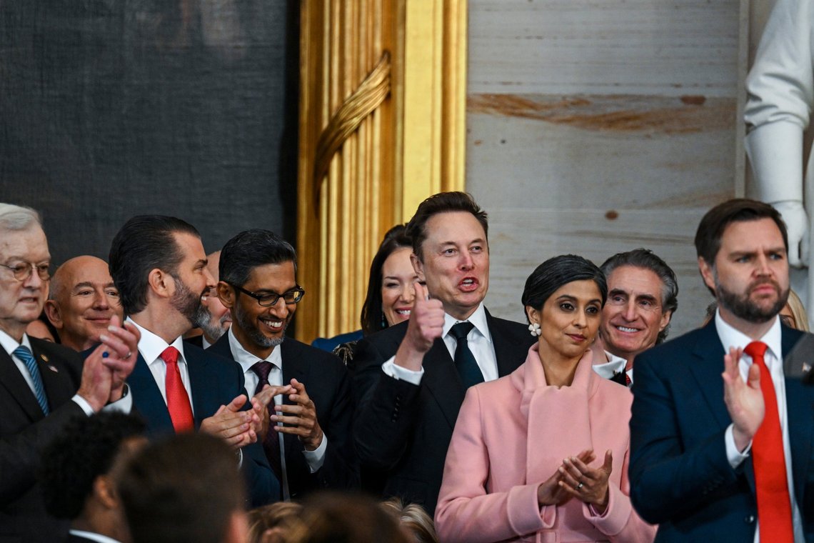 Jeff Bezos, from second left, Donald Trump Jr., Sundar Pichai, Elon Musk, Usha Vance, Doug Burgum and Vice President JD Vance applaud during the 60th Presidential Inauguration in the Rotunda of the U.S. Capitol in Washington, Monday, Jan. 20, 2025. (Kenny Holston/The New York Times via AP, Pool) Jeff Bezos, from second left, Donald Trump Jr., Sundar Pichai, Elon Musk, Usha Vance, Doug Burgum and Vice President JD Vance applaud during the 60th Presidential Inauguration in the Rotunda of the U.S. Capitol in Washington, Monday, Jan. 20, 2025. (Kenny Holston/The New York Times via AP, Pool)