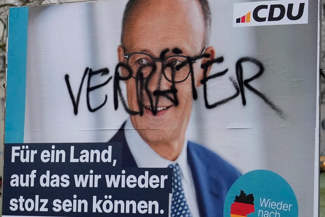 A defaced election poster for the Christian Democratic Union (CDU) with top candidate Friedrich Merz that reads 'Traitor' is displayed on a road in Halberstadt, Germany, Sunday, Feb. 1, 2025. (AP Photo/Matthias Schrader) A defaced election poster for the Christian Democratic Union (CDU) with top candidate Friedrich Merz that reads 'Traitor' is displayed on a road in Halberstadt, Germany, Sunday, Feb. 1, 2025. (AP Photo/Matthias Schrader)