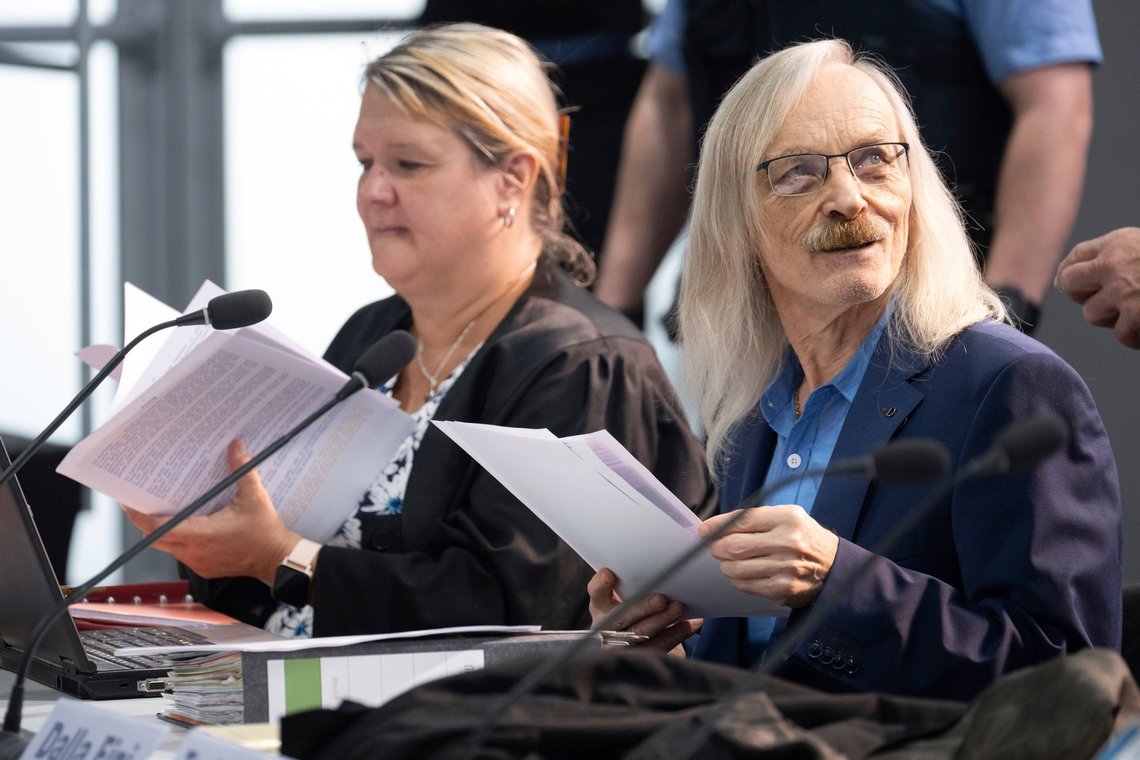 Maximilian Eder, defendant in the trial against an alleged "Reichsbürger group", right, sits next to his lawyer Ilka Lang-Seifert at a courthouse in Frankfurt, Germany, Tuesday, June 25, 2024. The alleged leaders of a suspected far-right plot to topple Germany's government went on trial last month, opening the most prominent proceedings in a case that shocked the country in late 2022. (Boris Roessler/Pool Photo via AP) Maximilian Eder, defendant in the trial against an alleged "Reichsbürger group", right, sits next to his lawyer Ilka Lang-Seifert at a courthouse in Frankfurt, Germany, Tuesday, June 25, 2024. The alleged leaders of a suspected far-right plot to topple Germany's government went on trial last month, opening the most prominent proceedings in a case that shocked the country in late 2022. (Boris Roessler/Pool Photo via AP)