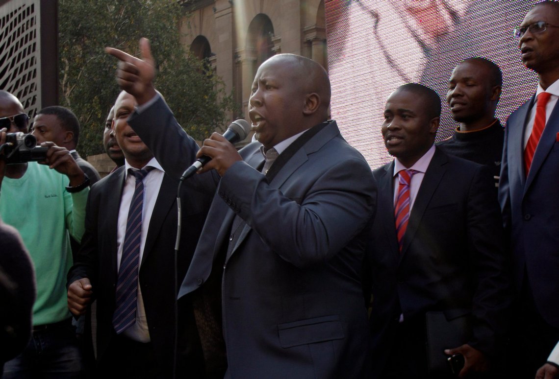 African National Congres Youth Legue president Julius Malema sings with his supporter after his appearence at the high court in Johannesburg, South Africa on Wednesday April. 20, 2011. Malema says the trial "has helped to shed some light," allowing him to explain why whites should not be offended when he sings "shoot the boer." (AP Photo/Themba Hadebe) African National Congres Youth Legue president Julius Malema sings with his supporter after his appearence at the high court in Johannesburg, South Africa on Wednesday April. 20, 2011. Malema says the trial "has helped to shed some light," allowing him to explain why whites should not be offended when he sings "shoot the boer." (AP Photo/Themba Hadebe)