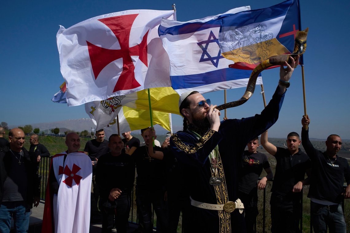 Members of the order of Knights Templar Grand Priory of the Holy Land gather near the Syrian border at the Israeli-annexed Golan Heights, Saturday, March 15, 2025, demanding support for the Christian minority in Syria. (AP Photo/Leo Correa) Members of the order of Knights Templar Grand Priory of the Holy Land gather near the Syrian border at the Israeli-annexed Golan Heights, Saturday, March 15, 2025, demanding support for the Christian minority in Syria. (AP Photo/Leo Correa)