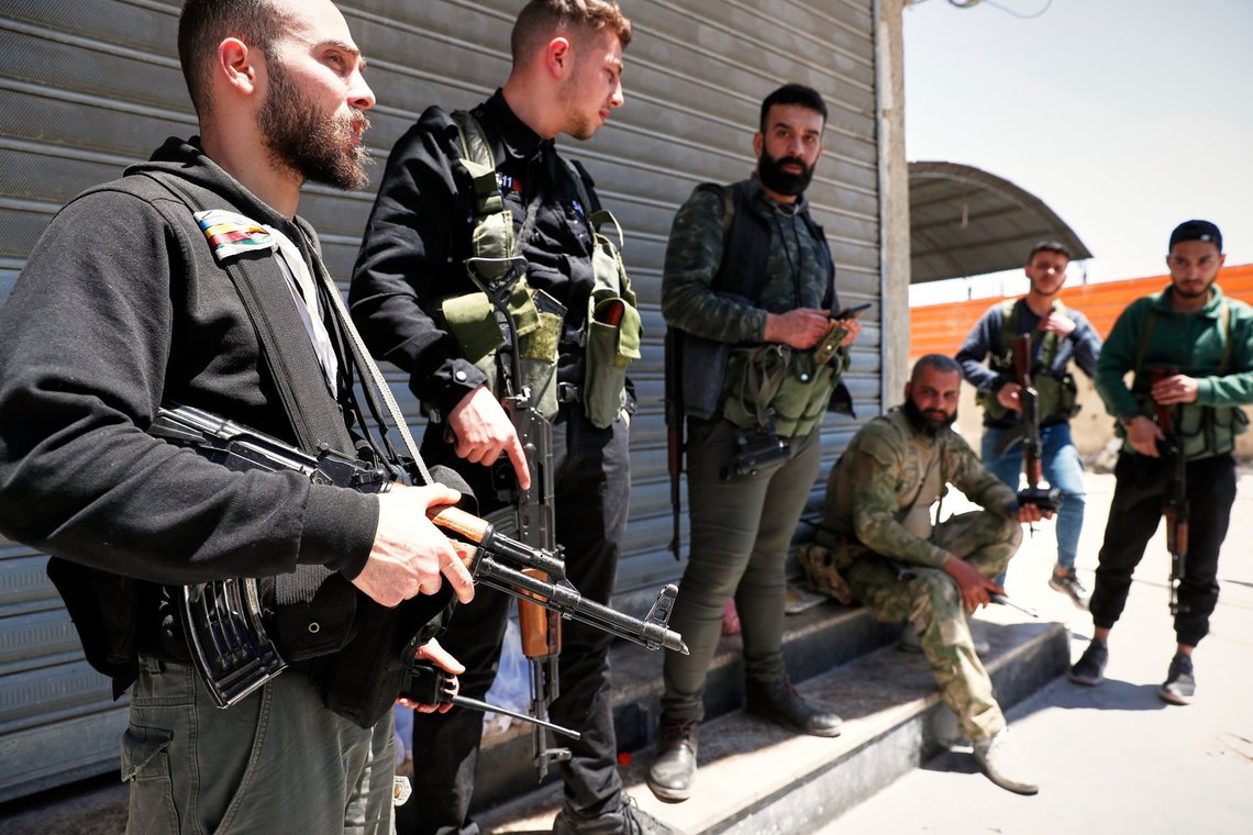Druze gunmen stand next to a checkpoint a day after clashes between members of the minority Druze sect and pro-government fighters left at least four people dead in the southern suburb of Jaramana, Damascus, Syria, Tuesday, April 29, 2025. (AP Photo/Omar Sanadiki) Druze gunmen stand next to a checkpoint a day after clashes between members of the minority Druze sect and pro-government fighters left at least four people dead in the southern suburb of Jaramana, Damascus, Syria, Tuesday, April 29, 2025. (AP Photo/Omar Sanadiki)