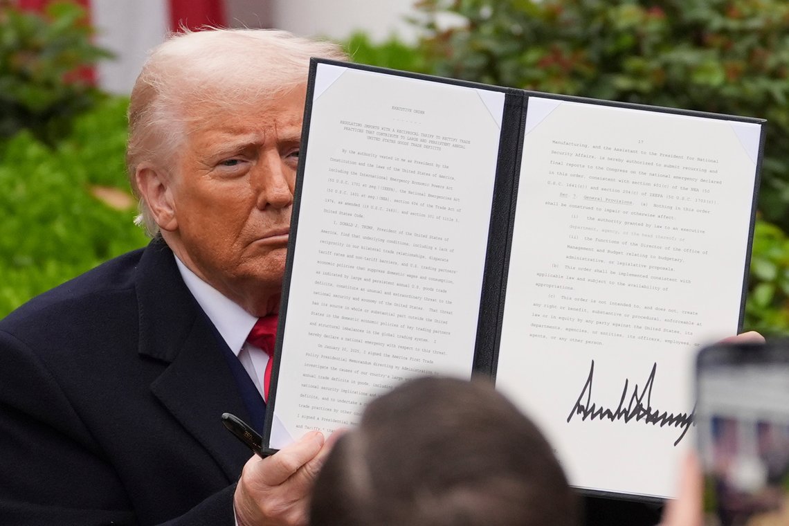 President Donald Trump holds a signed executive order during an event to announce new tariffs in the Rose Garden of the White House, Wednesday, April 2, 2025, in Washington. (AP Photo/Evan Vucci) President Donald Trump holds a signed executive order during an event to announce new tariffs in the Rose Garden of the White House, Wednesday, April 2, 2025, in Washington. (AP Photo/Evan Vucci)