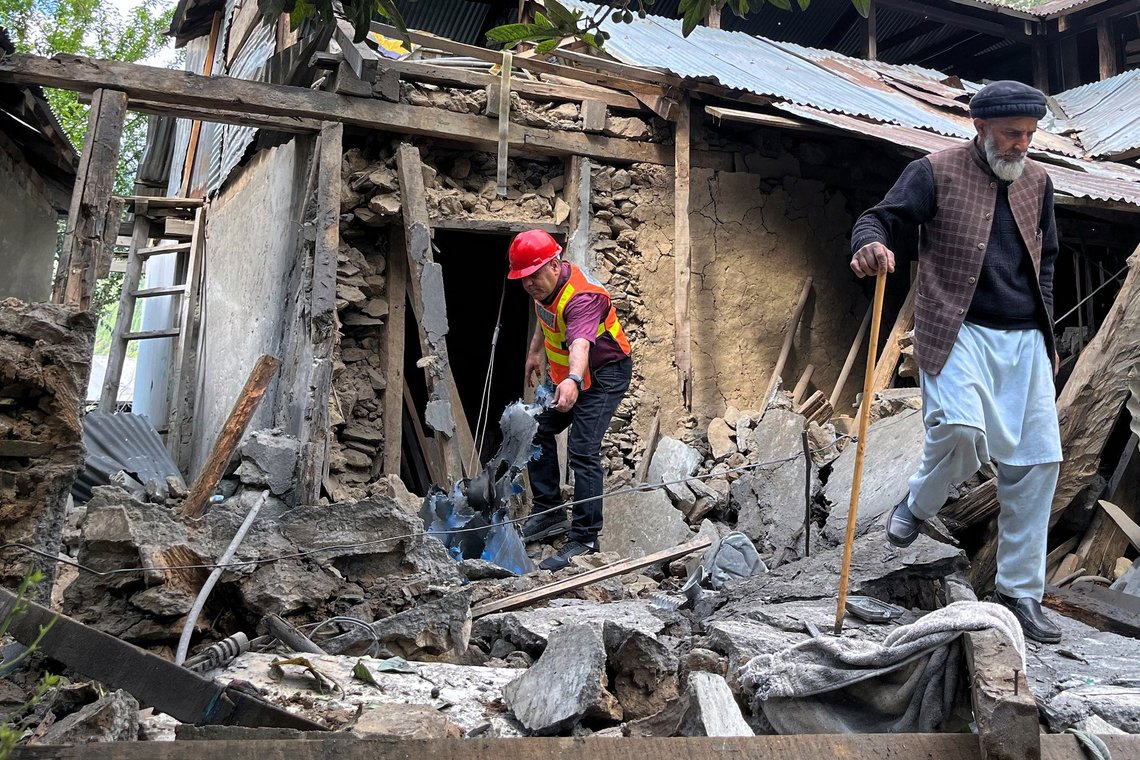 A Kashmiri villager and a rescue worker examine damages to a house caused by overnight Indian shelling, in Shah Kot, in Neelum Vallery, a district of Pakistan's administered Kashmir, Saturday, May 10, 2025. (AP Photo/M.D. Mughal) A Kashmiri villager and a rescue worker examine damages to a house caused by overnight Indian shelling, in Shah Kot, in Neelum Vallery, a district of Pakistan's administered Kashmir, Saturday, May 10, 2025. (AP Photo/M.D. Mughal)