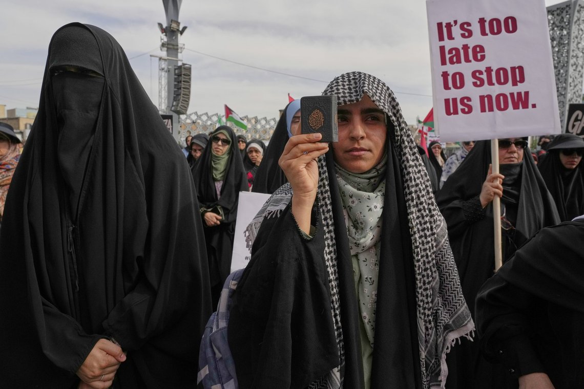 A demonstrator holds a copy of Islam's holy book, Quran, during a pro-Palestinian gathering in Tehran, Iran, Friday, May 2, 2025. (AP Photo/Vahid Salemi) A demonstrator holds a copy of Islam's holy book, Quran, during a pro-Palestinian gathering in Tehran, Iran, Friday, May 2, 2025. (AP Photo/Vahid Salemi)