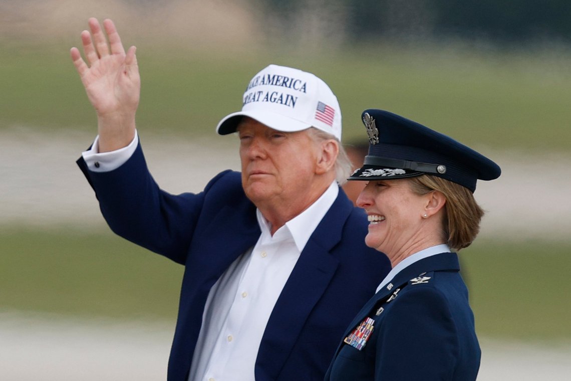 President Donald Trump waves as he is escorted by Air Force Col. Angela F. Ochoa, Commander, 89th Airlift Wing, as he walks from Air Force One before boarding Marine One, upon his arrival at Joint Base Andrews, Md., Sunday, May 25, 2025. (AP Photo/Luis M. Alvarez) President Donald Trump waves as he is escorted by Air Force Col. Angela F. Ochoa, Commander, 89th Airlift Wing, as he walks from Air Force One before boarding Marine One, upon his arrival at Joint Base Andrews, Md., Sunday, May 25, 2025. (AP Photo/Luis M. Alvarez)