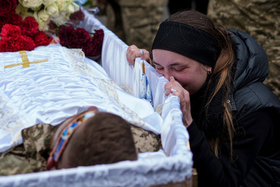 A relative cries at the coffin of Dmytro Shapovalov, a Ukrainian serviceman, during his funeral ceremony at the church in Yosypivka village, Vinnytsia region, Ukraine, on Friday, June 13, 2025. (AP Photo/Evgeniy Maloletka) A relative cries at the coffin of Dmytro Shapovalov, a Ukrainian serviceman, during his funeral ceremony at the church in Yosypivka village, Vinnytsia region, Ukraine, on Friday, June 13, 2025. (AP Photo/Evgeniy Maloletka)