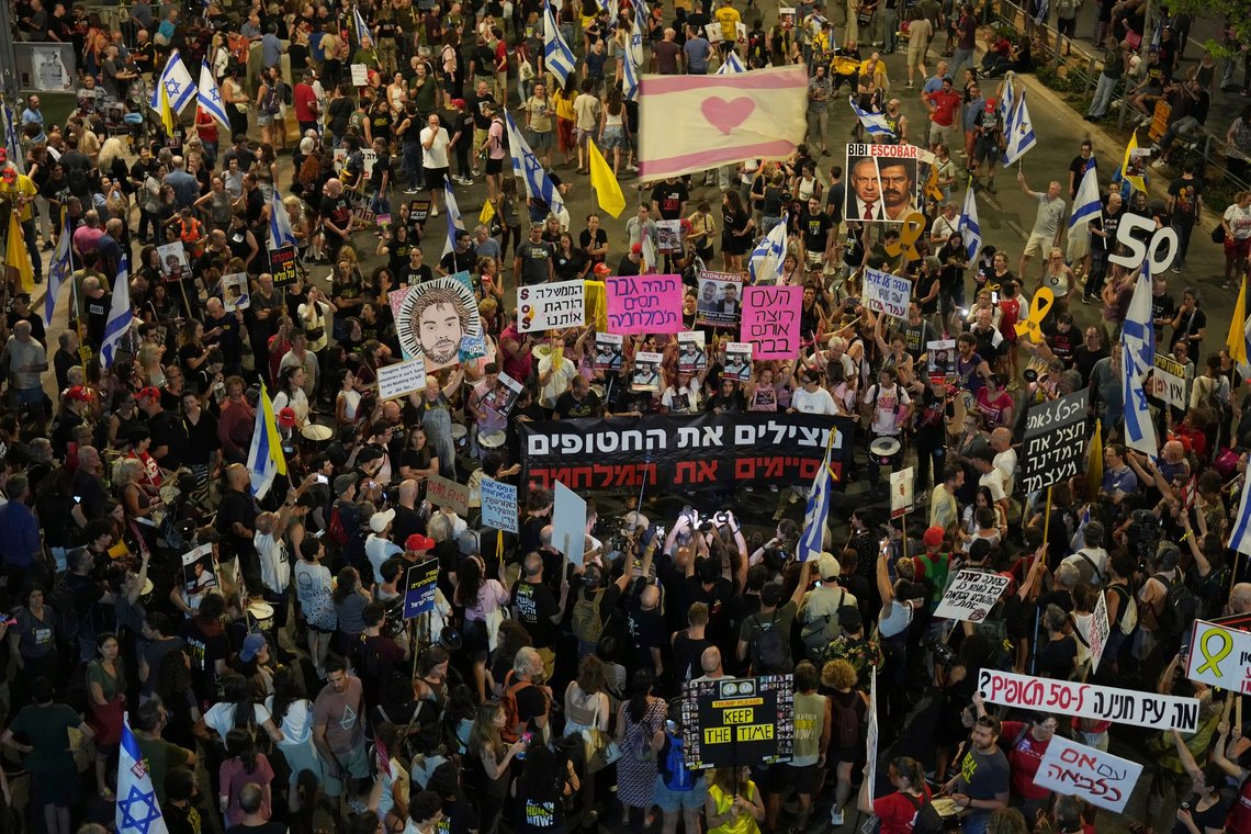 People take part in a protest demanding the end of the war and immediate release of hostages held by Hamas in the Gaza Strip, and against Prime Minister Benjamin Netanyahu's government in Tel Aviv, Israel, Saturday, June 28, 2025. (AP Photo/Ariel Schalit) People take part in a protest demanding the end of the war and immediate release of hostages held by Hamas in the Gaza Strip, and against Prime Minister Benjamin Netanyahu's government in Tel Aviv, Israel, Saturday, June 28, 2025. (AP Photo/Ariel Schalit)