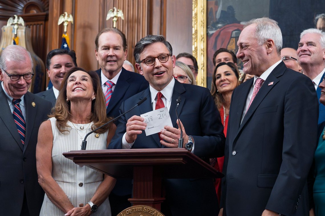 Speaker of the House Mike Johnson, R-La., flanked by Rep. Lisa McClain, R-Mich., left, and Majority Leader Steve Scalise, R-La., right, holds the vote tally sheet as he celebrates with fellow Republicans after final passage of President Donald Trump's signature bill of tax breaks and spending cuts, at the Capitol in Washington, Thursday, July 3, 2025. (AP Photo/J. Scott Applewhite) Speaker of the House Mike Johnson, R-La., flanked by Rep. Lisa McClain, R-Mich., left, and Majority Leader Steve Scalise, R-La., right, holds the vote tally sheet as he celebrates with fellow Republicans after final passage of President Donald Trump's signature bill of tax breaks and spending cuts, at the Capitol in Washington, Thursday, July 3, 2025. (AP Photo/J. Scott Applewhite)