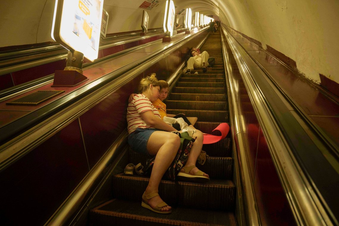 A mother with her daughter sleeps on the stairs of a metro station as they take cover during a Russian attack on Kyiv, Ukraine, on Thursday, July 10, 2025. (AP Photo/Evgeniy Maloletka) A mother with her daughter sleeps on the stairs of a metro station as they take cover during a Russian attack on Kyiv, Ukraine, on Thursday, July 10, 2025. (AP Photo/Evgeniy Maloletka)