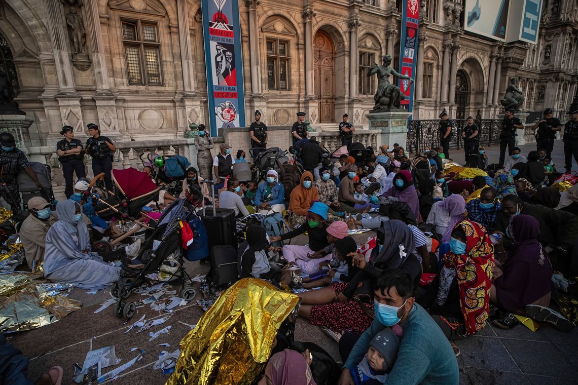 People take part in a rally called by the association Utopia 56 in support of several homeless families outside Paris City Hall, France, Tuesday, Aug. 5, 2025. (AP Photo/Aurelien Morissard) People take part in a rally called by the association Utopia 56 in support of several homeless families outside Paris City Hall, France, Tuesday, Aug. 5, 2025. (AP Photo/Aurelien Morissard)