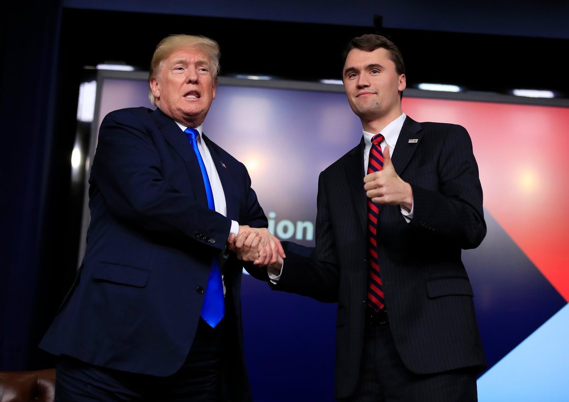 FILE - President Donald Trump shakes hands with moderator Charlie Kirk, during a Generation Next White House forum at the Eisenhower Executive Office Building on the White House complex in Washington, Thursday, March 22, 2018. (AP Photo/Manuel Balce Ceneta, File) FILE - President Donald Trump shakes hands with moderator Charlie Kirk, during a Generation Next White House forum at the Eisenhower Executive Office Building on the White House complex in Washington, Thursday, March 22, 2018. (AP Photo/Manuel Balce Ceneta, File)