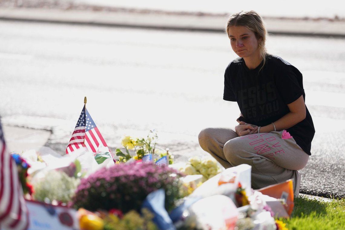 Meagan Bradley kneels at a memorial is set up for Charlie Kirk at Utah Valley University in Orem, Utah, Friday, Sept. 12, 2025. (AP Photo/Lindsey Wasson) Meagan Bradley kneels at a memorial is set up for Charlie Kirk at Utah Valley University in Orem, Utah, Friday, Sept. 12, 2025. (AP Photo/Lindsey Wasson)