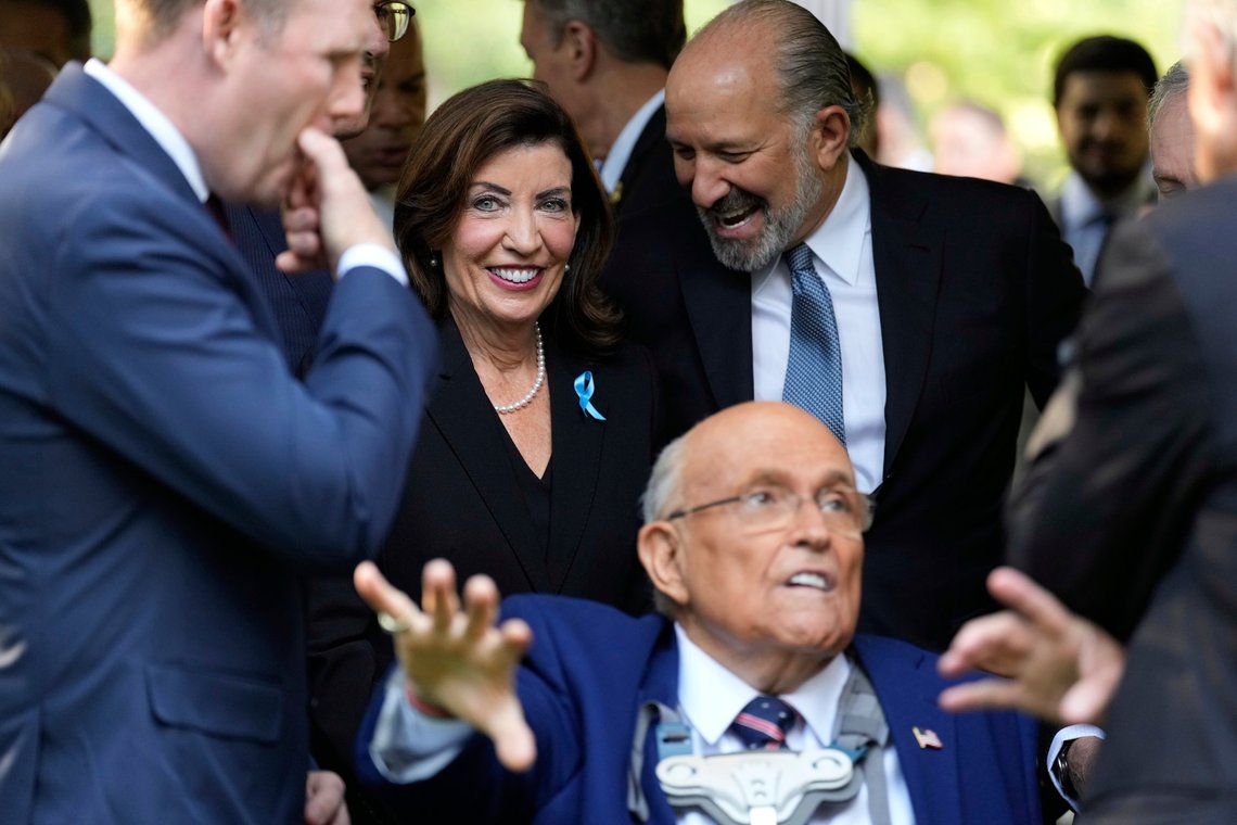 New York governor Kathy Hochul, center, arrives as former NYC mayor Rudy Giuliani sits in a chair for a ceremony to mark the 24th anniversary of the 9/11 attacks, Thursday, Sept. 11, 2025, in New York. (AP Photo/Seth Wenig) New York governor Kathy Hochul, center, arrives as former NYC mayor Rudy Giuliani sits in a chair for a ceremony to mark the 24th anniversary of the 9/11 attacks, Thursday, Sept. 11, 2025, in New York. (AP Photo/Seth Wenig)