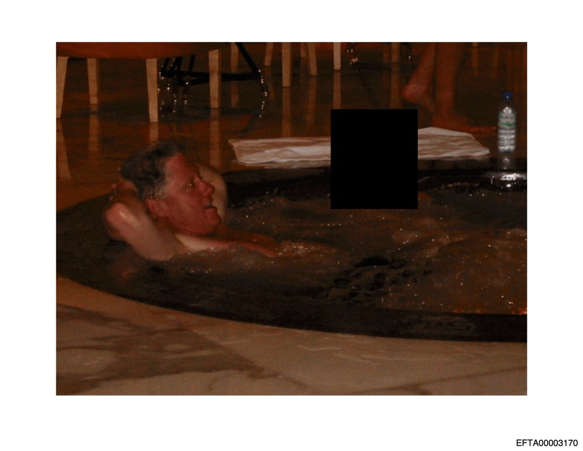 This undated, redacted photo released by the U.S. Department of Justice shows former President Bill Clinton in a hot tub with an unknown person. (U.S. Department of Justice via AP) This undated, redacted photo released by the U.S. Department of Justice shows former President Bill Clinton in a hot tub with an unknown person. (U.S. Department of Justice via AP)