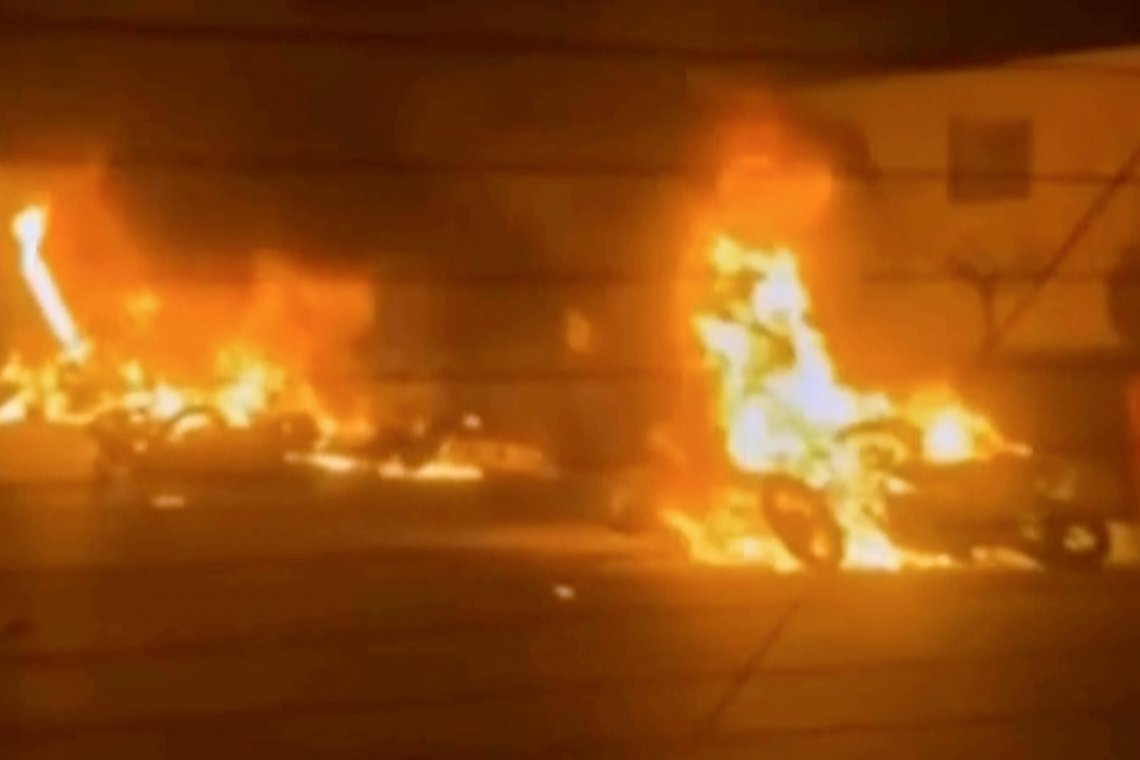 This frame grab from a video released by Iran state TV shows vehicles burning amid night of mass protests in Tehran, Iran, Thursday, Jan. 8, 2026. (Iran state TV via AP) This frame grab from a video released by Iran state TV shows vehicles burning amid night of mass protests in Tehran, Iran, Thursday, Jan. 8, 2026. (Iran state TV via AP)
